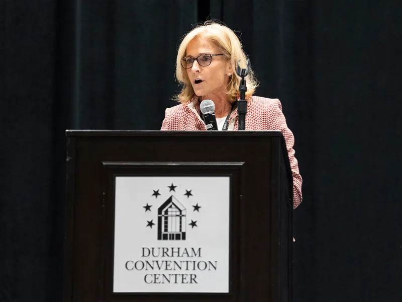 Woman talking at a podium