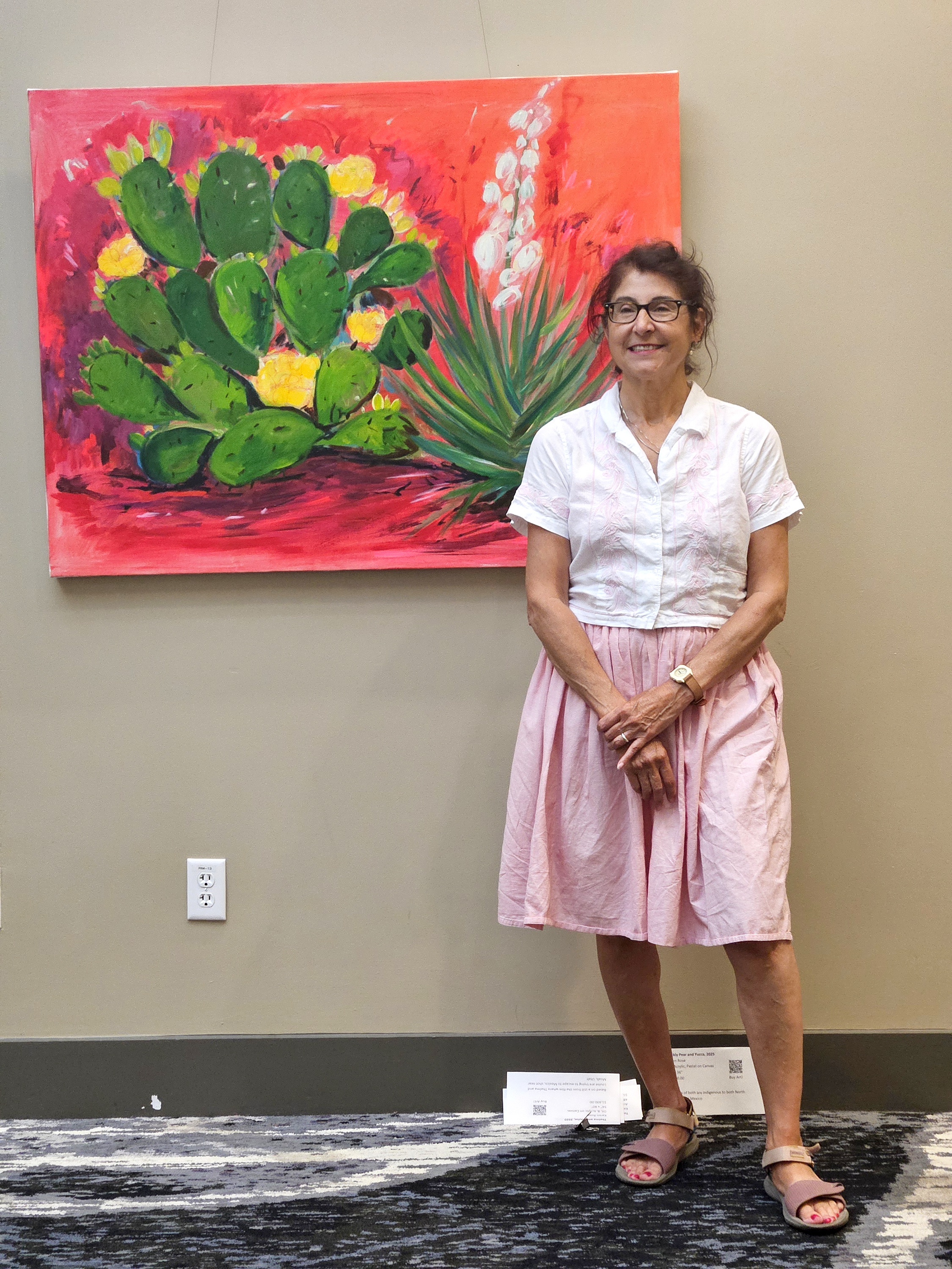 Karen Rose Karen Rose posing next to cactus photo in the Durham Convention Center.
